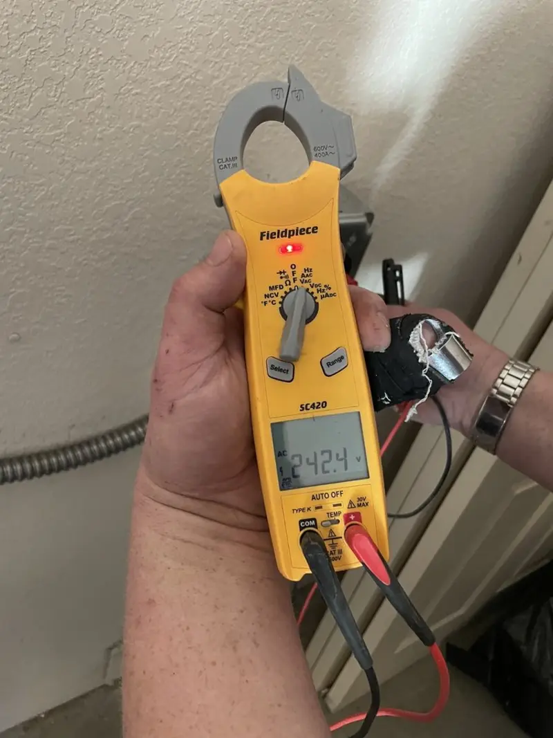 Voltage testing with clamp meter during Generator Installation in Cedar Creek